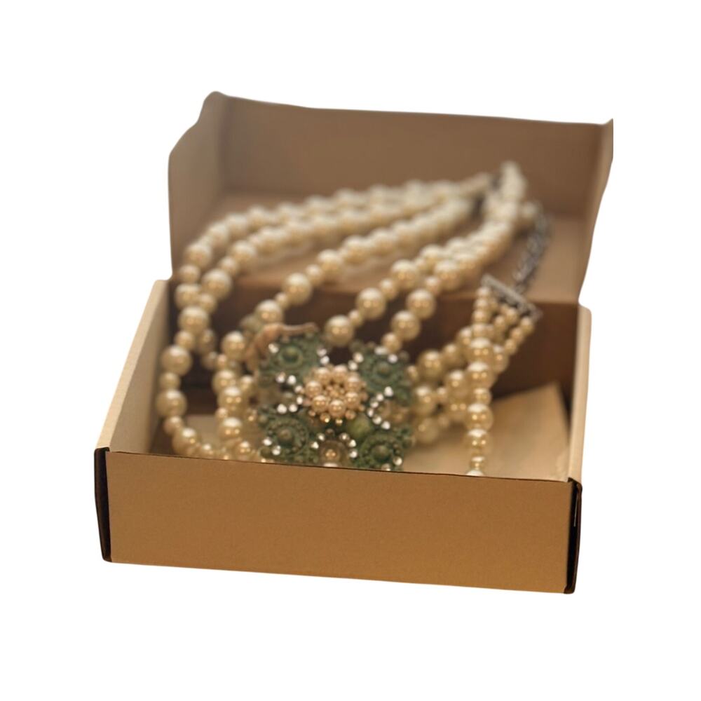 A Rare Bird Multi-Strand Pearl Necklace with Green Crystal Floral Accent